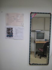 Put on personal protective equipment in the preparation room before entering the isolation rooms